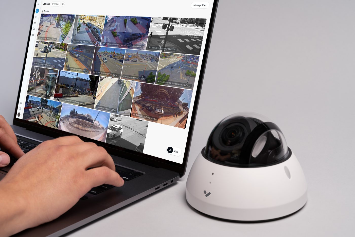 Verkada Command open on a laptop beside a dome camera